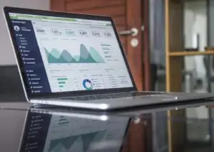 a laptop showing data graphs
